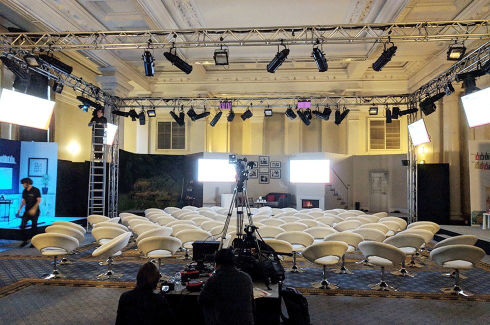 Lighting rig being set up above bespoke set in Lecture Hall