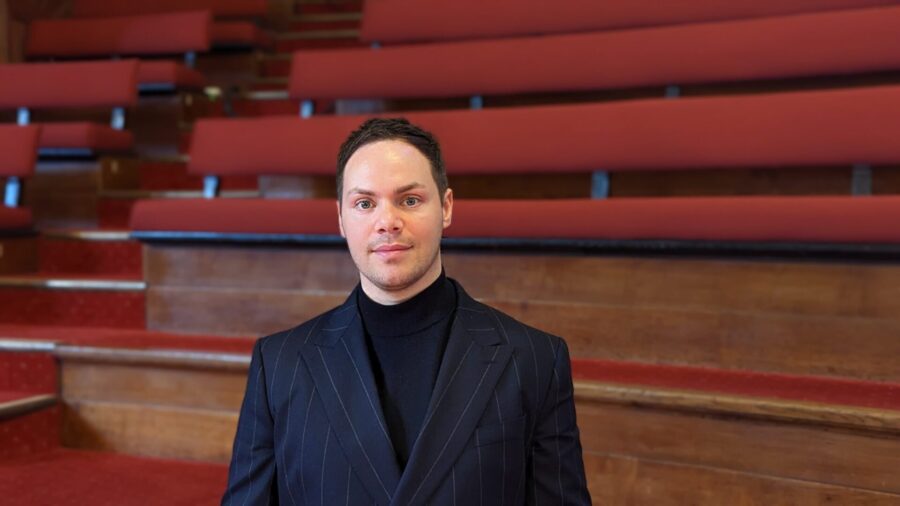 Liam Farrelly with Great Hall Choir stools in background